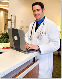 Image of Doctor working on a Laptop
